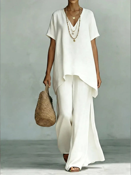 White V-neck tunic top and wide-leg pants set, draped asymmetric hems