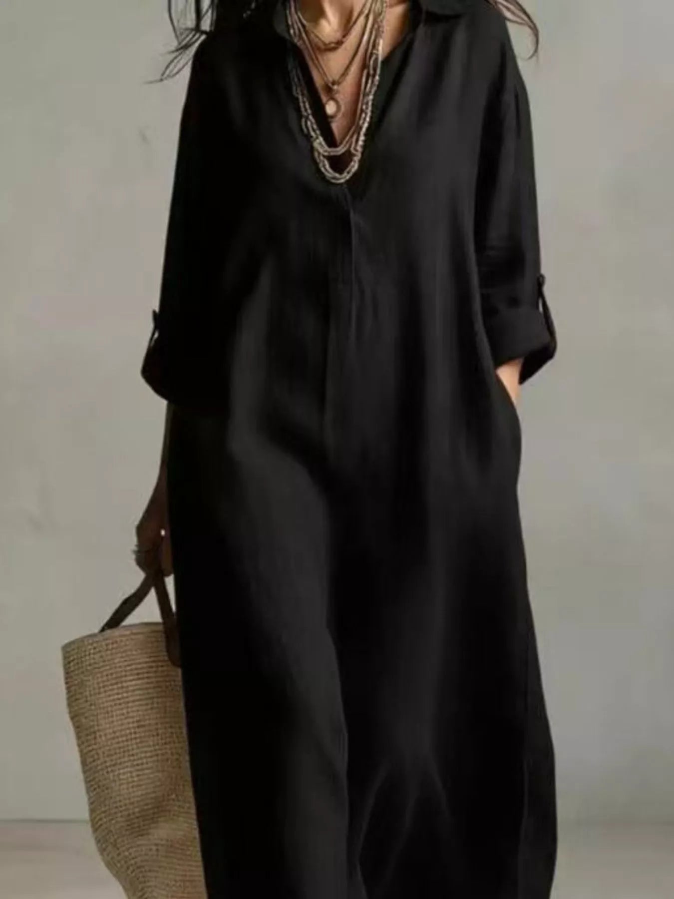 Black midi shirt dress with button placket, V-neck, short sleeves and loose fit