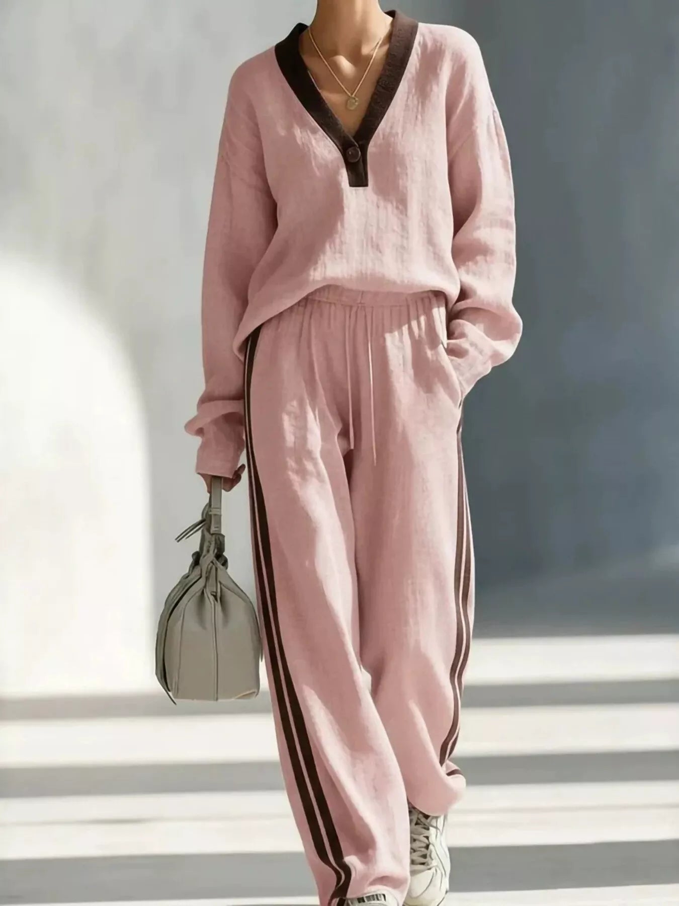 Pink V-neck top and striped jogger pants set with contrast neckline trim