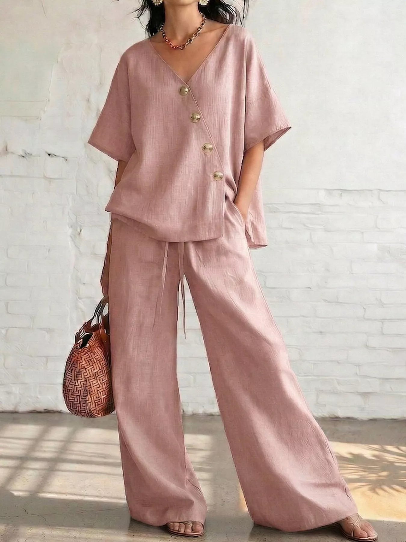 Pink surplice half-sleeve top with gold buttons and wide-leg pants set