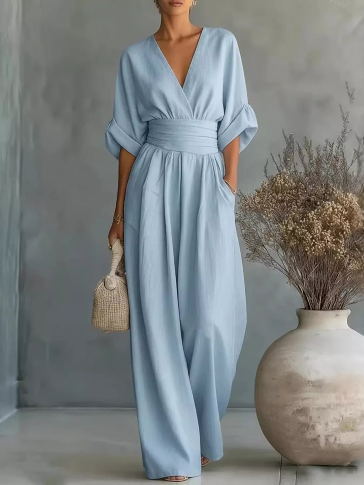 Light blue plus size jumpsuit with V-neck, half sleeves, elastic waist, wide legs