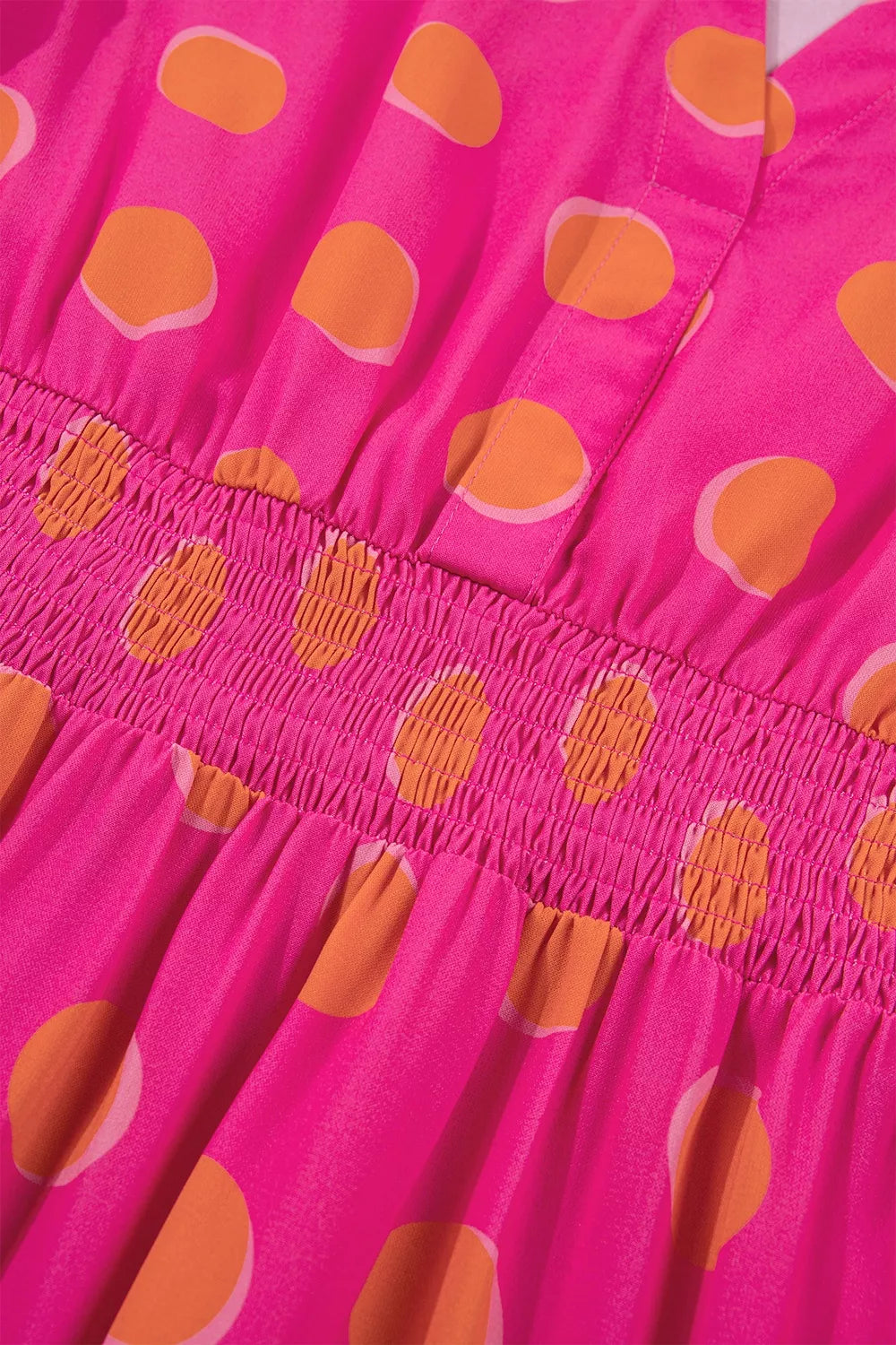 Hot pink polka dot smocked waist tiered skirt with gathered ruffle details