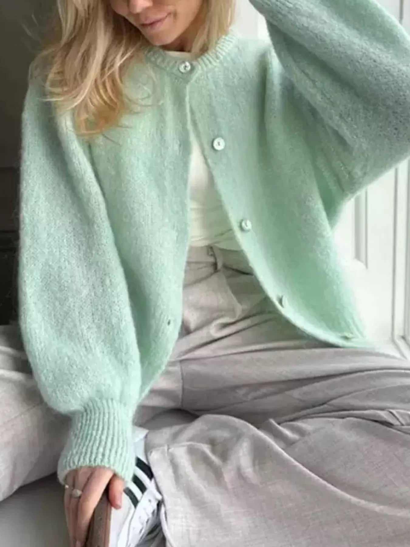 Light green button-up long sleeve cardigan with front buttons and ribbed cuffs