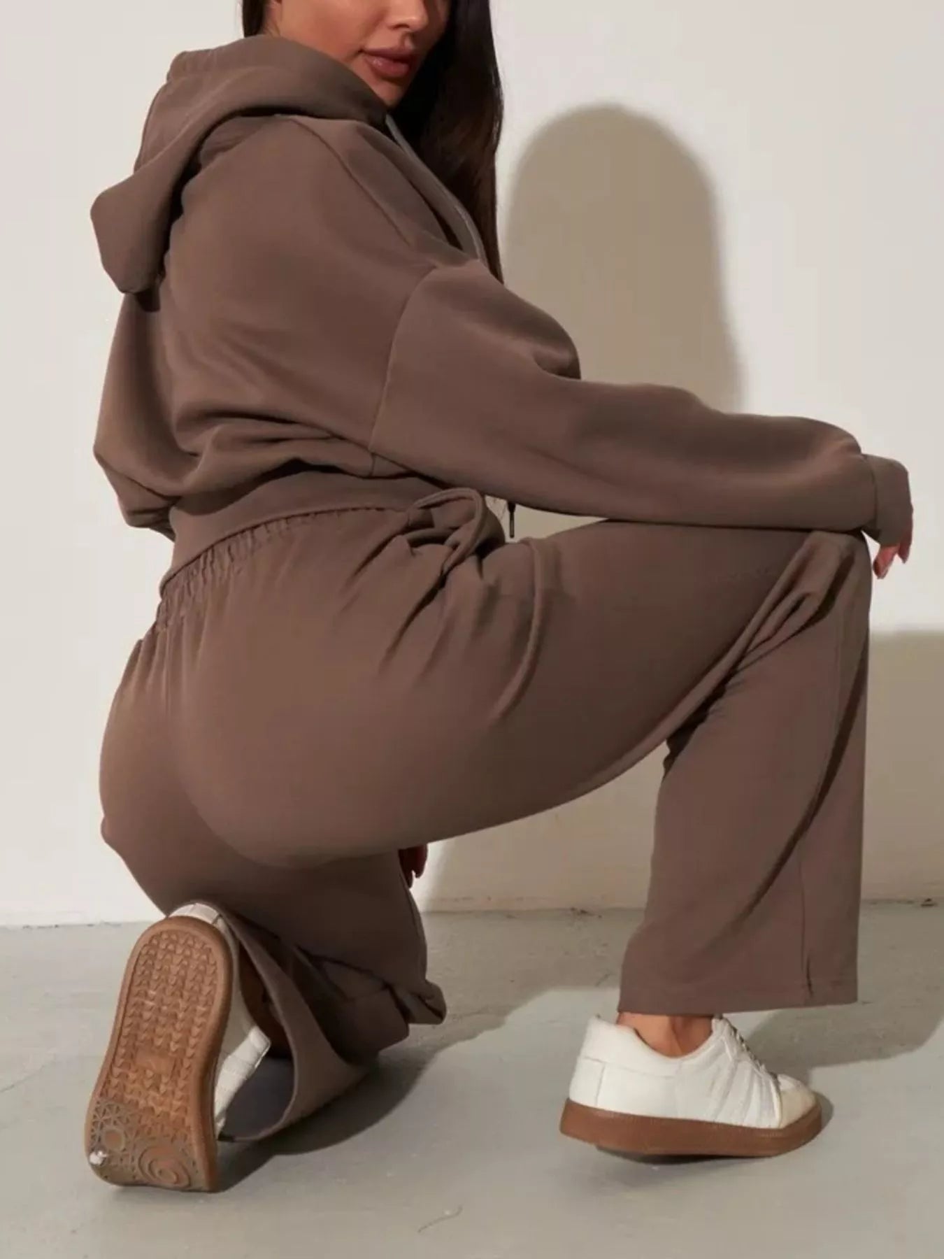 Brown zip-up hoodie and wide-leg pants set with hood, adjustable drawstrings, and wide legs