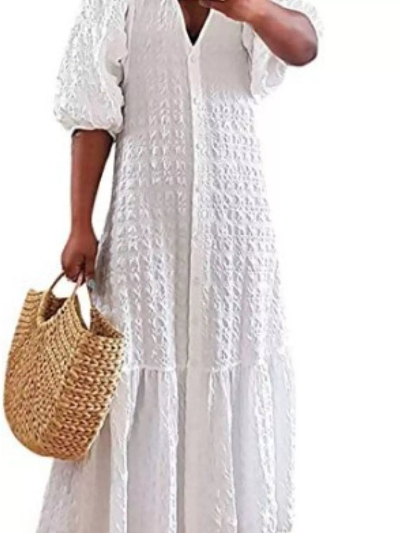 White textured maxi dress with V-neck and gathered puff sleeves, flowing tiered skirt