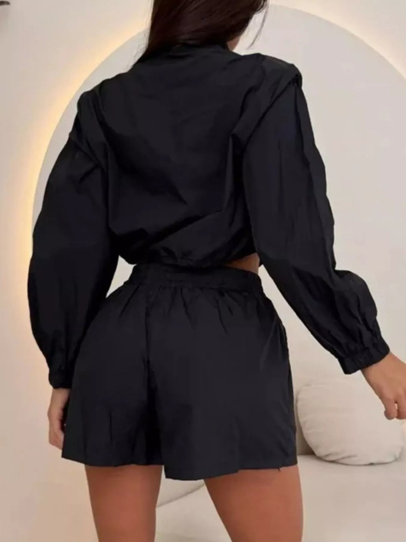 Black zip-up long-sleeve jacket and shorts set, drawstring waist, back view