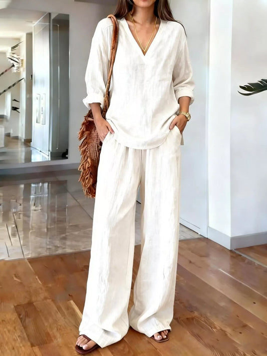 White V-neck top and wide-leg pants set with elbow-length sleeves and elastic waist