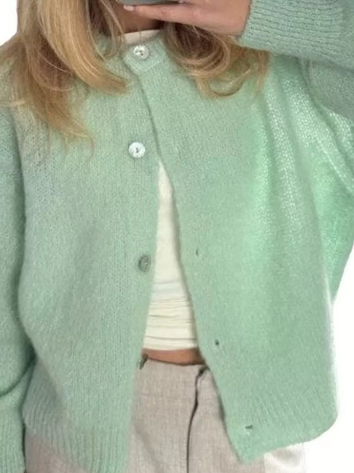 Light green button-up long sleeve cardigan with round neckline and front button closure