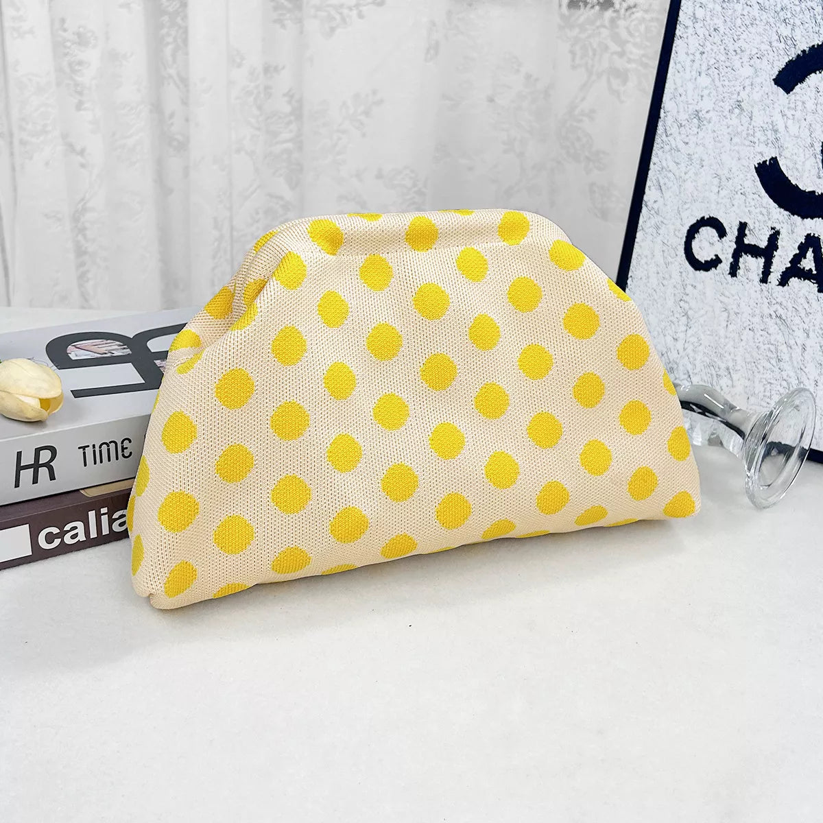 Light yellow knit polka-dot clutch with white dots