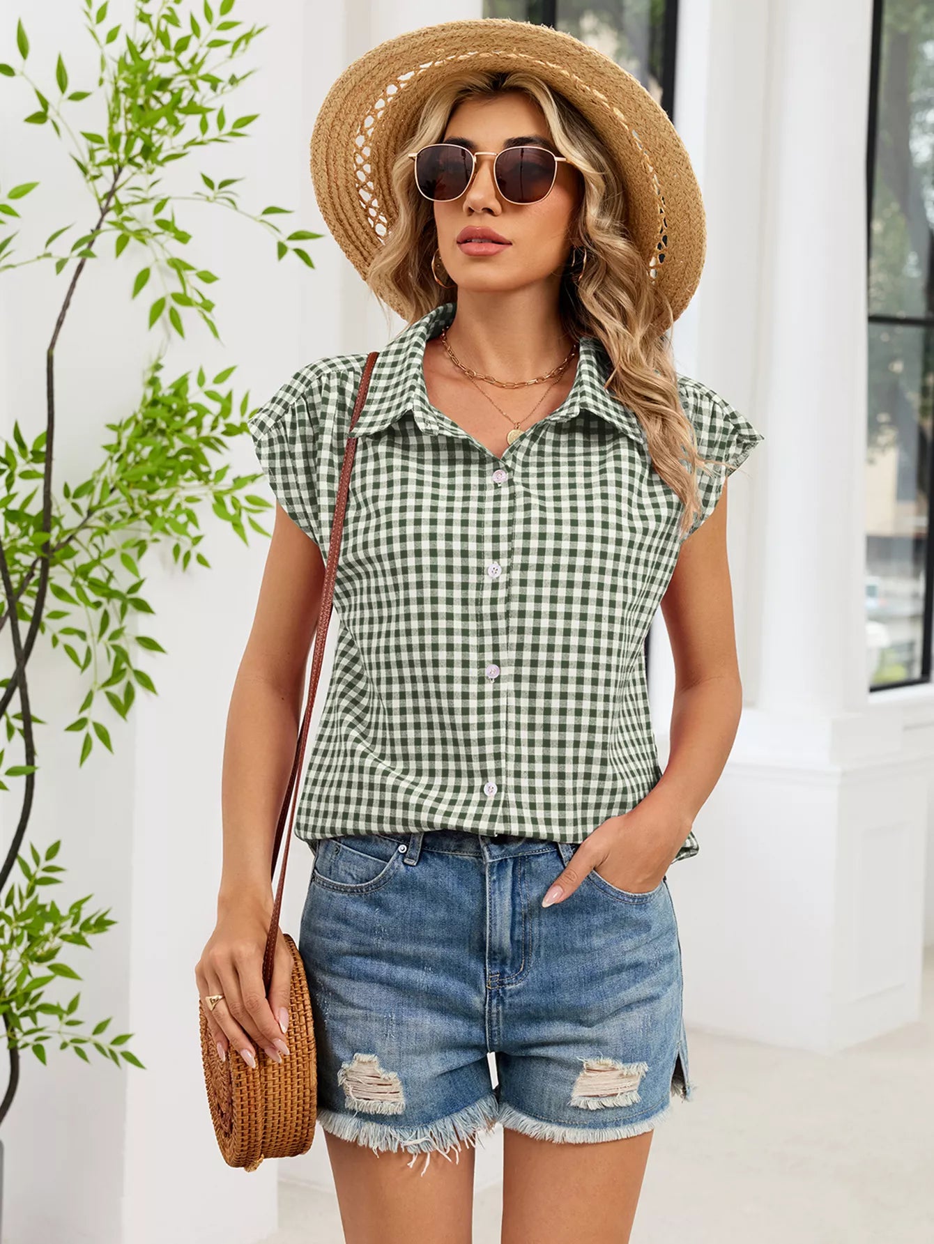 Green plaid cap-sleeve button-up shirt with collar and partial button front