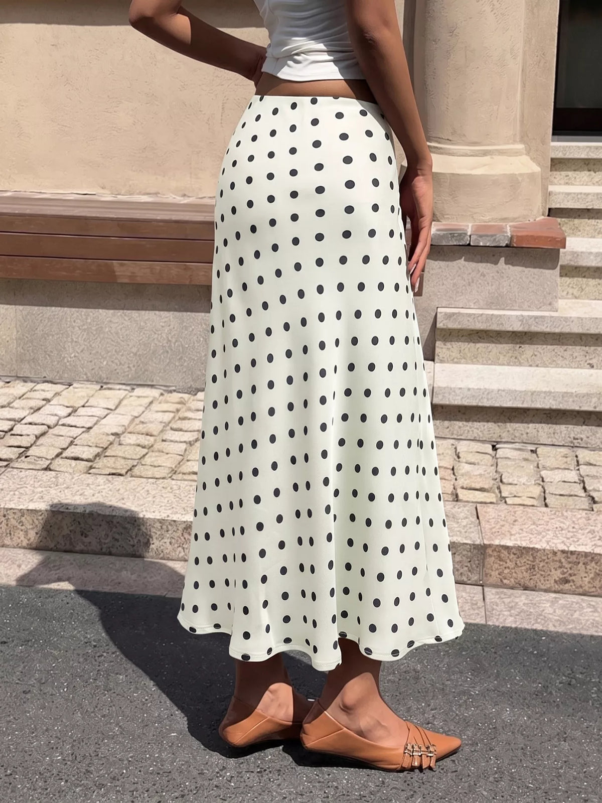 Cream polka dot midi skirt with black dots, high waist and full A-line silhouette
