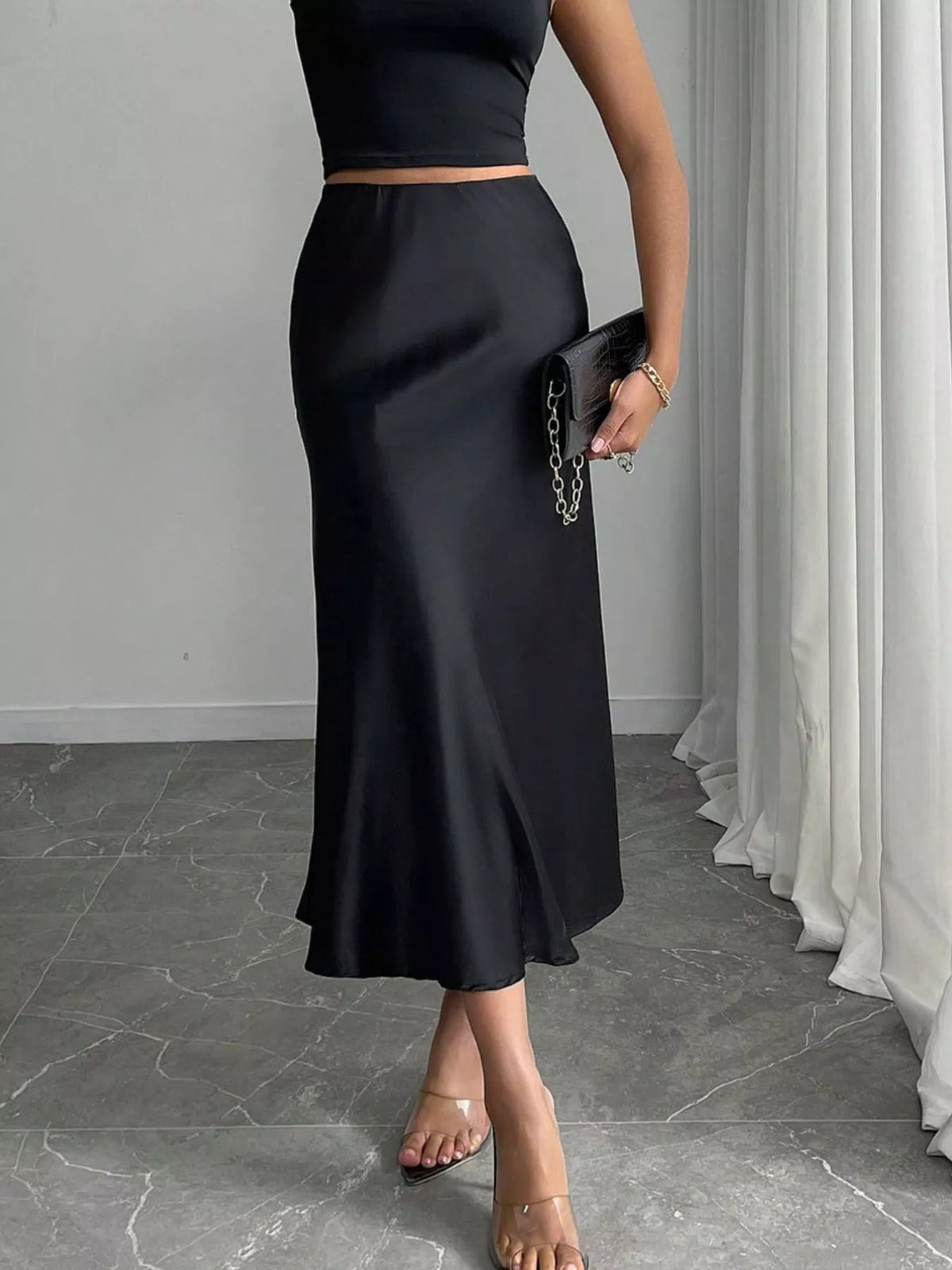 Satin midi skirt in dark gray, side view with flowing hem and back seam