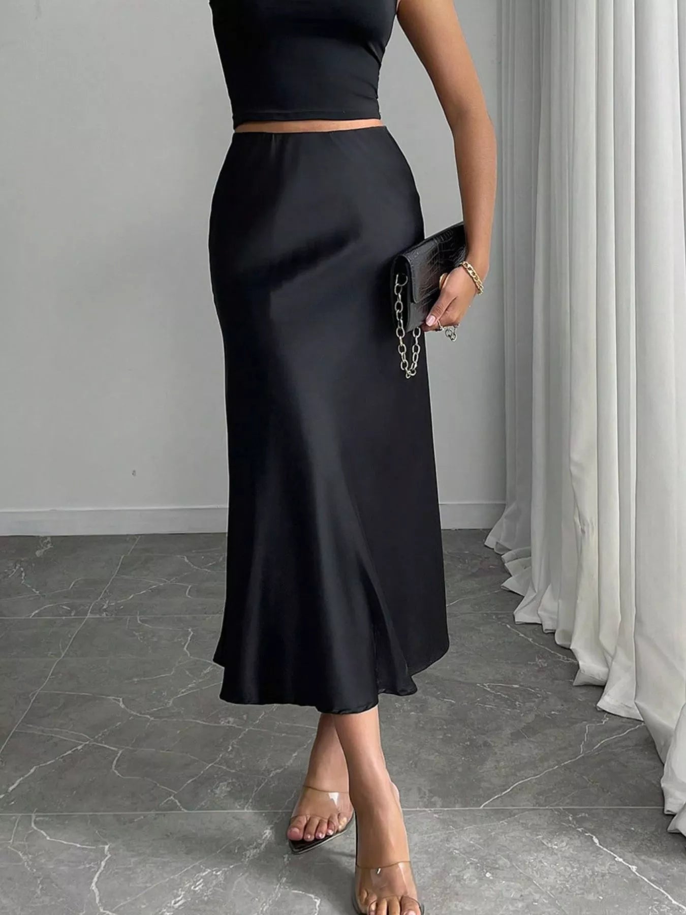 Satin midi skirt in dark gray, side view with flowing hem and back seam