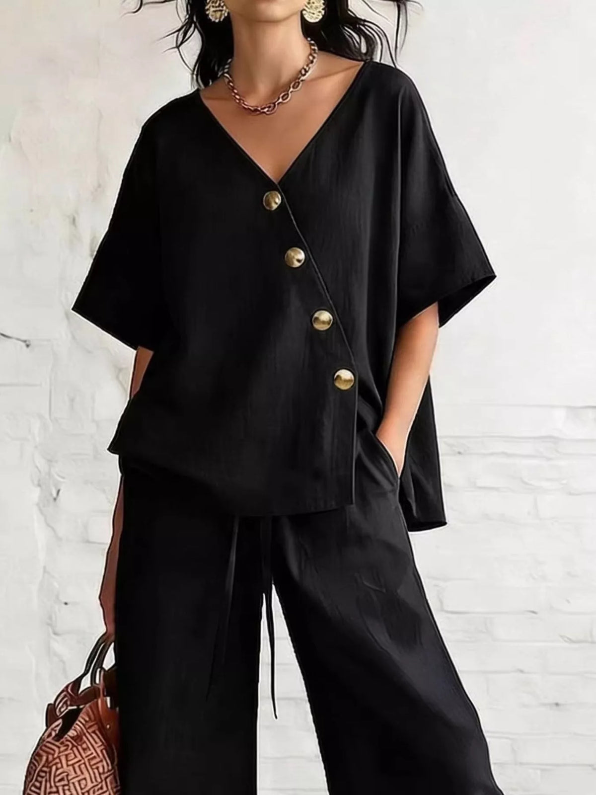 Black surplice button-front half-sleeve top with wide-leg pants