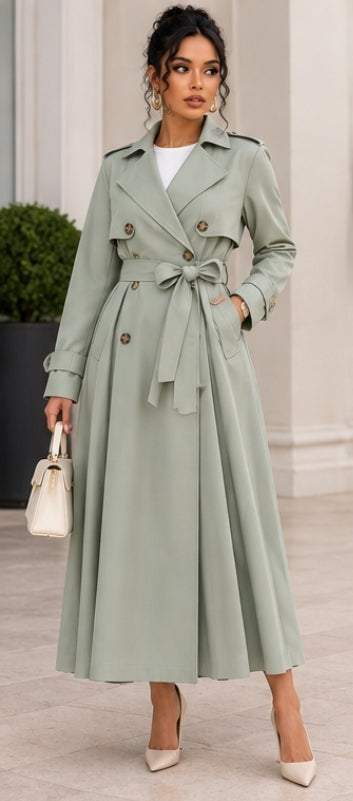 Front view of a sage-green belted trench coat on model