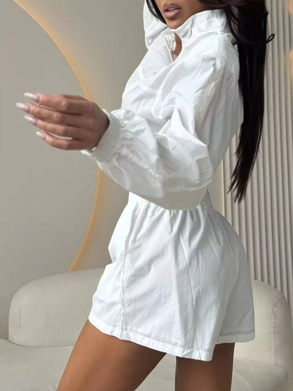 White zip-up long sleeve jacket and shorts set with elastic waist, front view