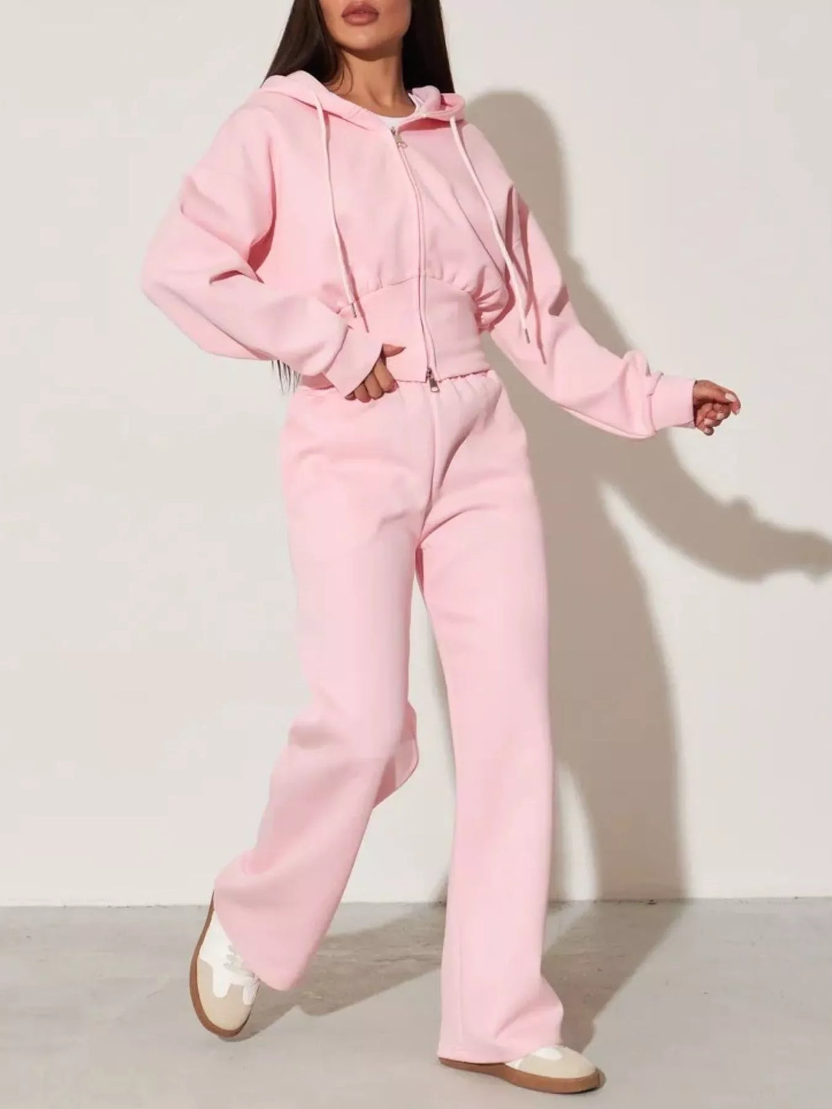Pink zip-up hoodie and wide-leg pants set, full-body front view with wide-leg pants