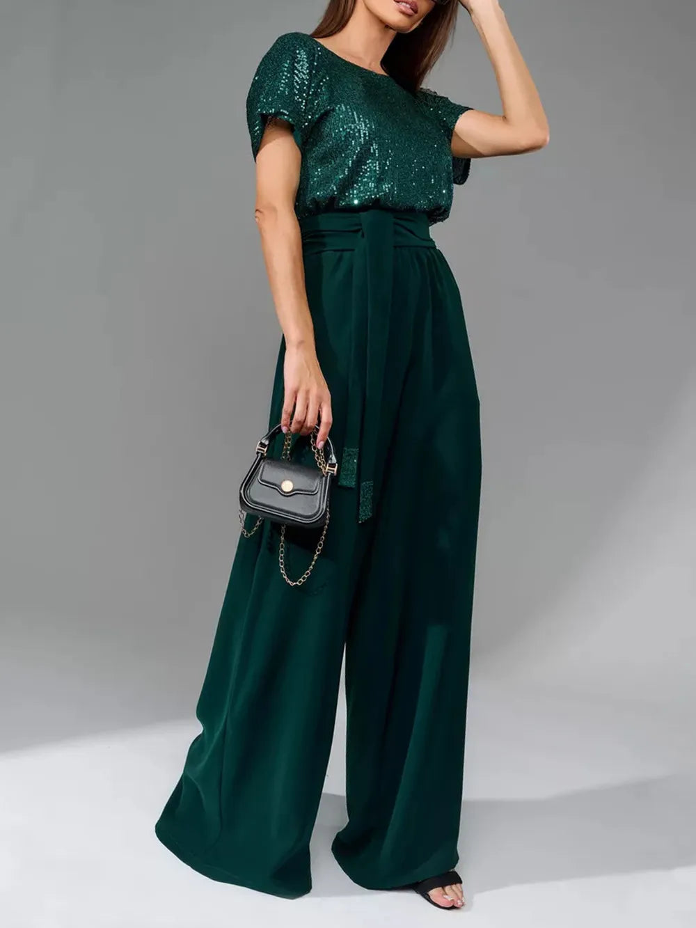 Dark green sequin short-sleeve wide-leg jumpsuit with belted waist and drape