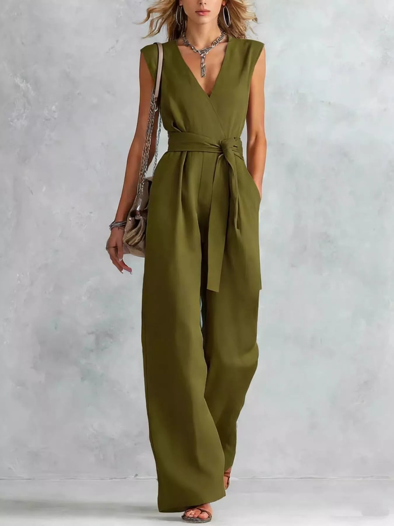 Sleeveless wide-leg jumpsuit in army green with V-neck and tied waist belt