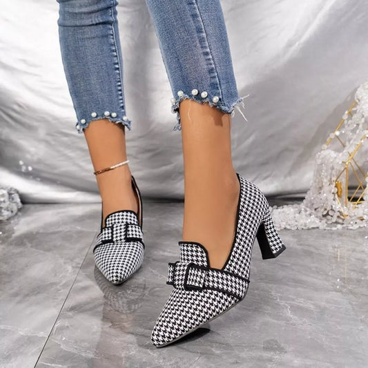 Point-toe block heel pumps with houndstooth upper and buckle strap, black
