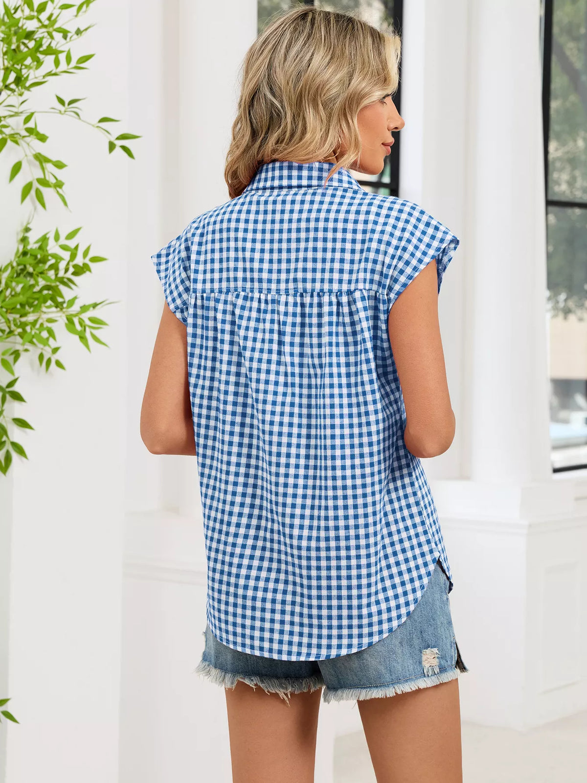 Blue and white plaid button-up cap sleeve shirt, back view with short sleeves