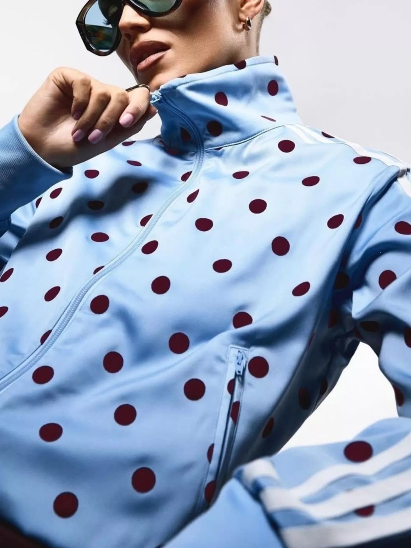 Sky blue polka-dot zip-up outerwear with front zipper, stand collar, striped cuffs