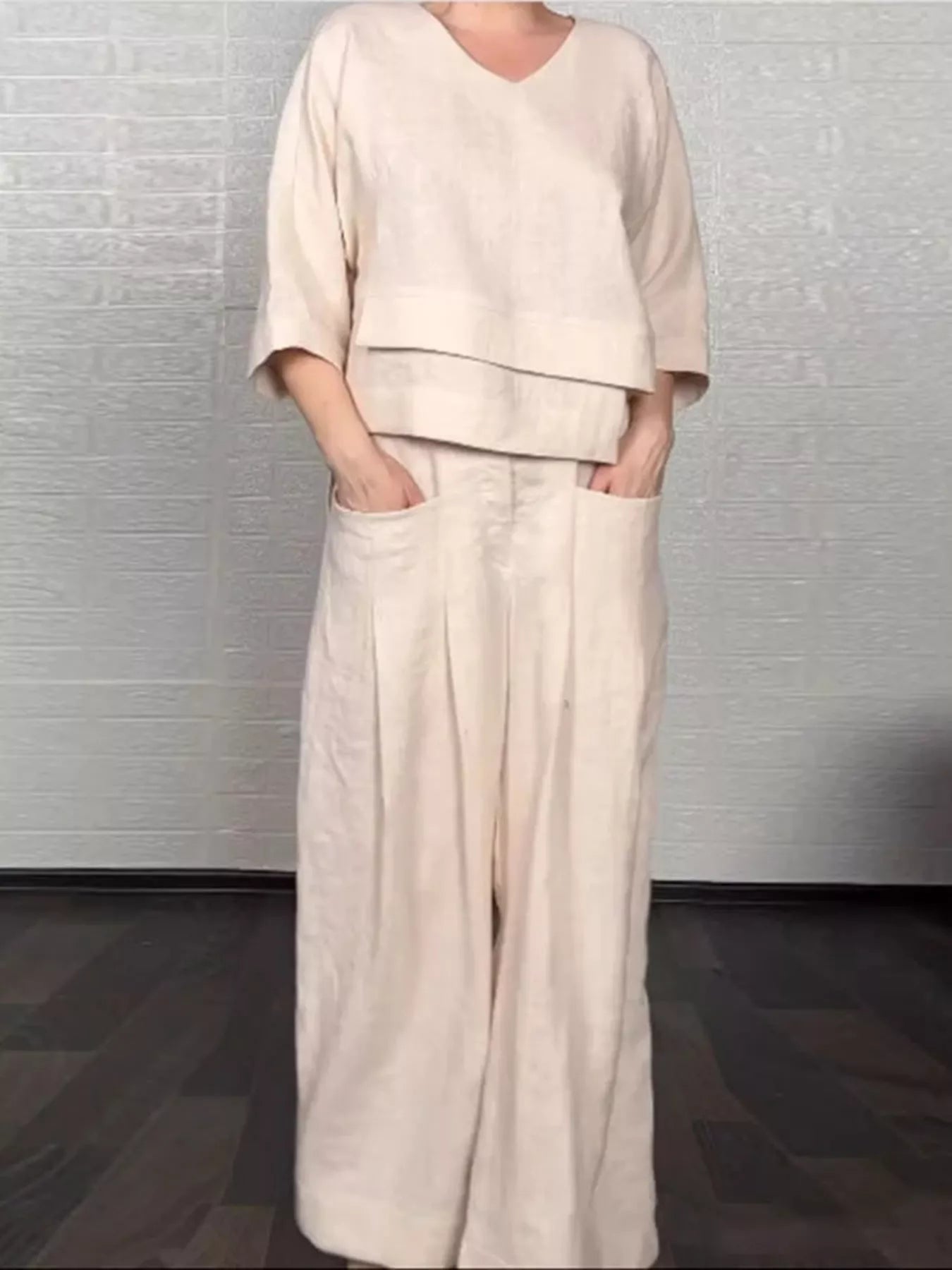Apricot V-neck long sleeve top and wide-leg pants set, relaxed fit with layered hem.