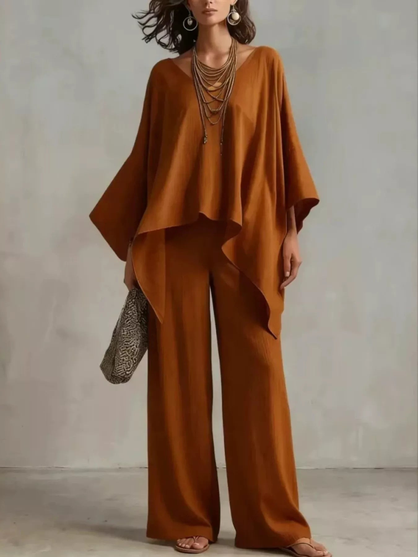 Brown V-neck top and wide-leg pants set with flowy drape sleeves and asymmetrical detail