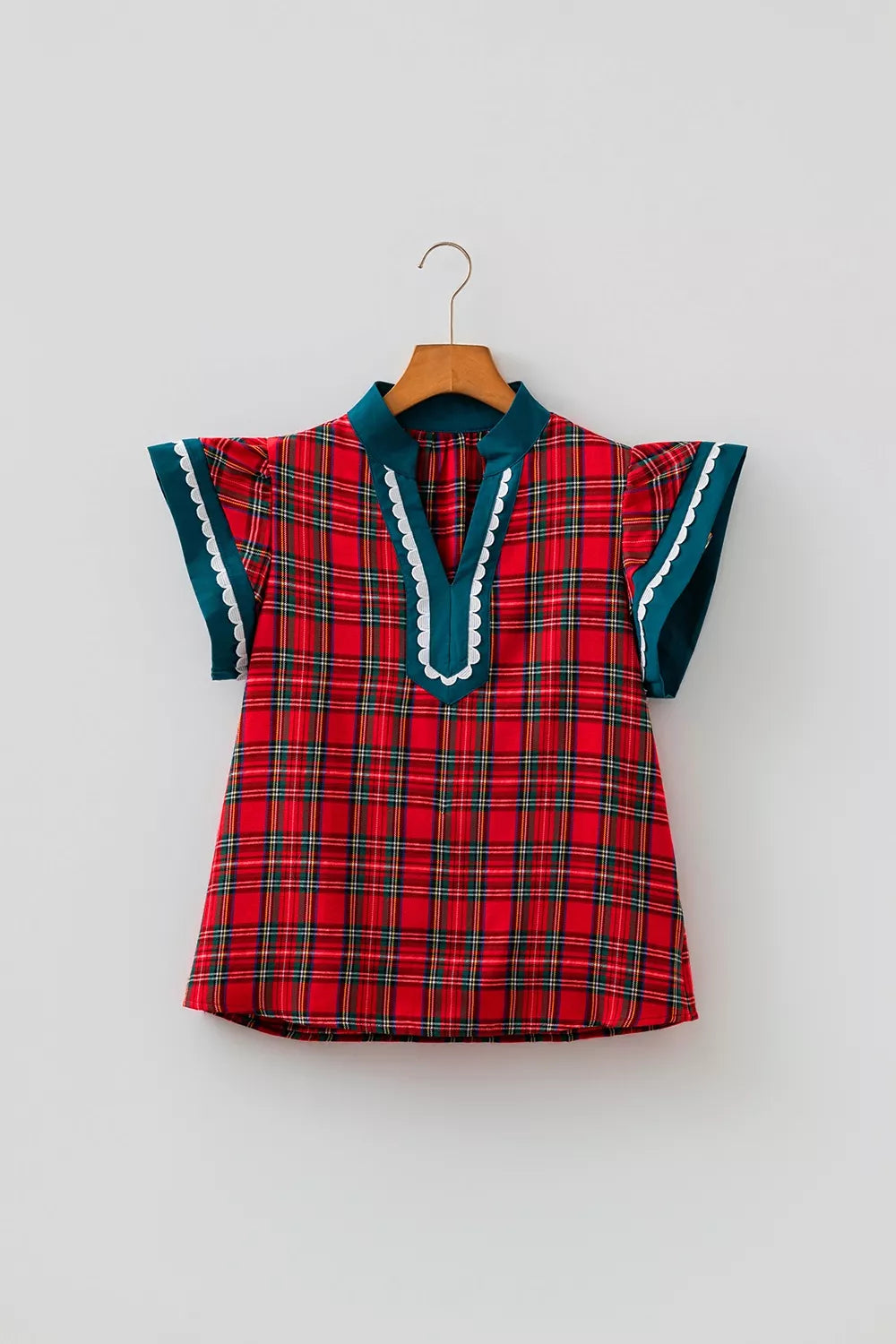 Deep red plaid V-neck shift blouse with teal scalloped trim and short flutter sleeves
