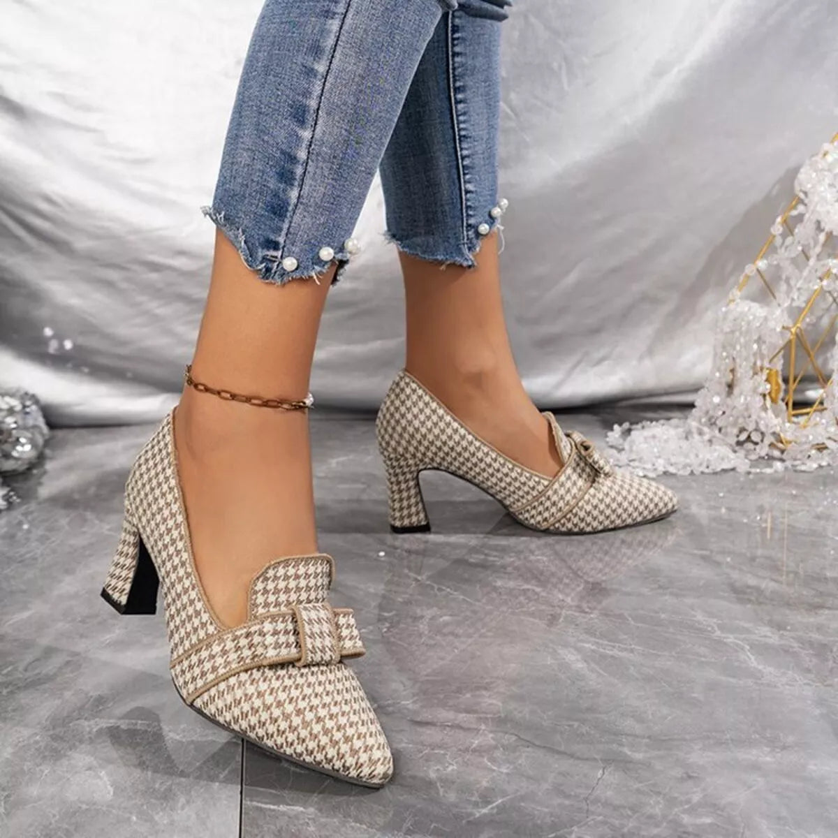 Point-toe block heel pumps in beige houndstooth, side view with mid-height block heel