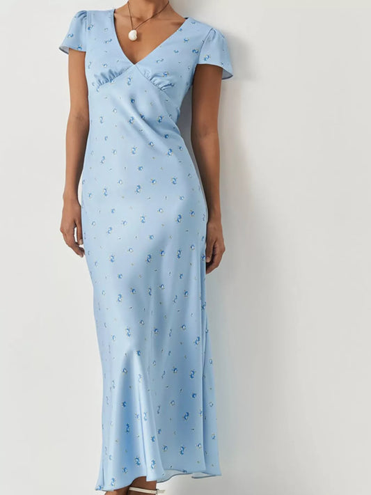 Light blue V-neck cap sleeve maxi dress with allover small blue floral pattern