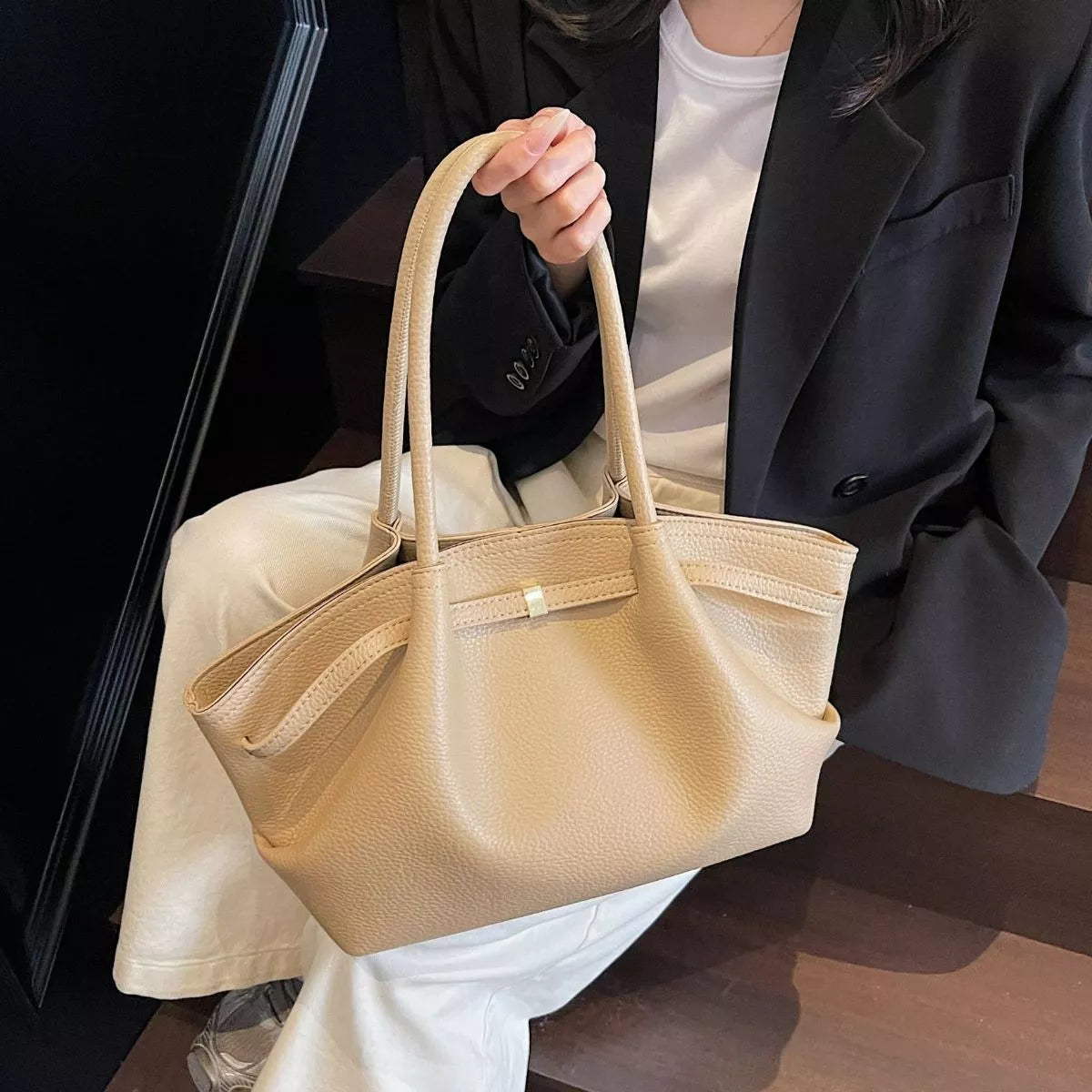 Khaki beige PU leather shoulder bag with structured shape, top handles, and inner pocket