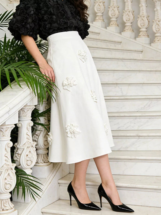 White midi skirt with scattered floral appliqués, A-line