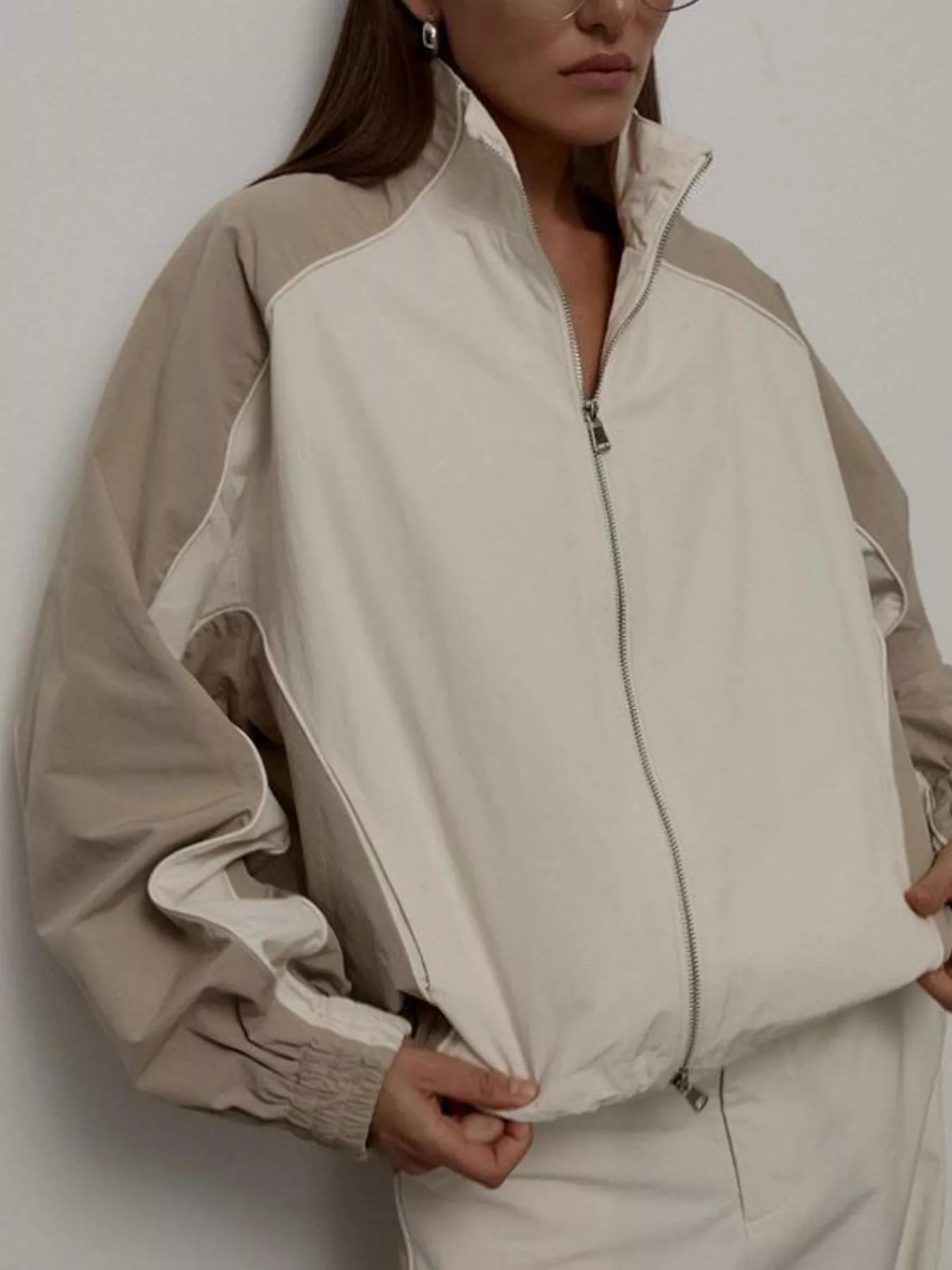 Color-block zip-up outerwear jacket set with light beige/cream contrast panels.