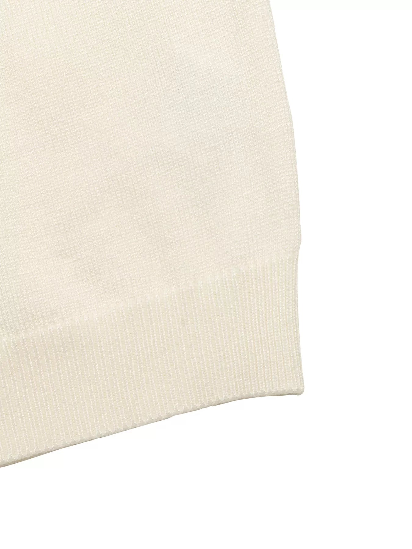 Apricot knit top sleeve cuff with ruffle hem detail