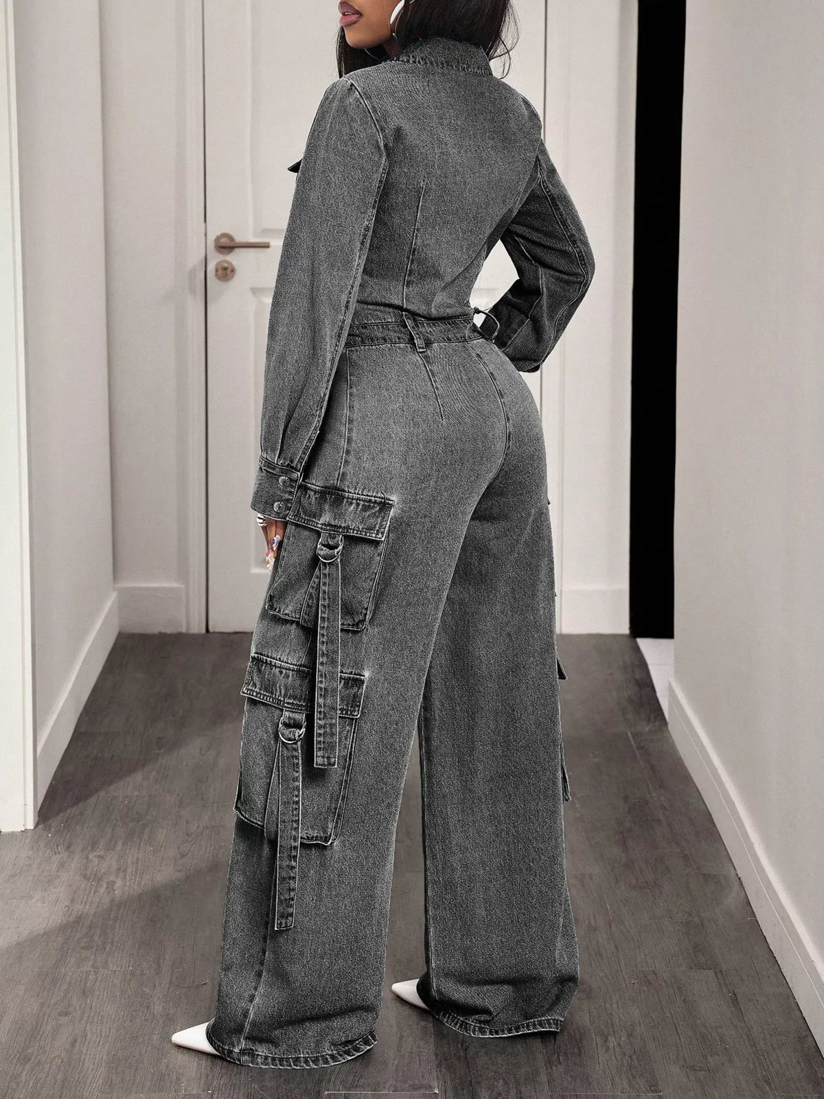 Gray denim cargo jumpsuit, zip-front, shown from back with wide-leg pant silhouette