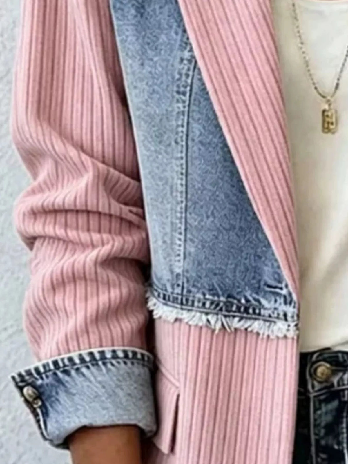 Blush pink ribbed denim blazer with frayed hem and light blue denim panel