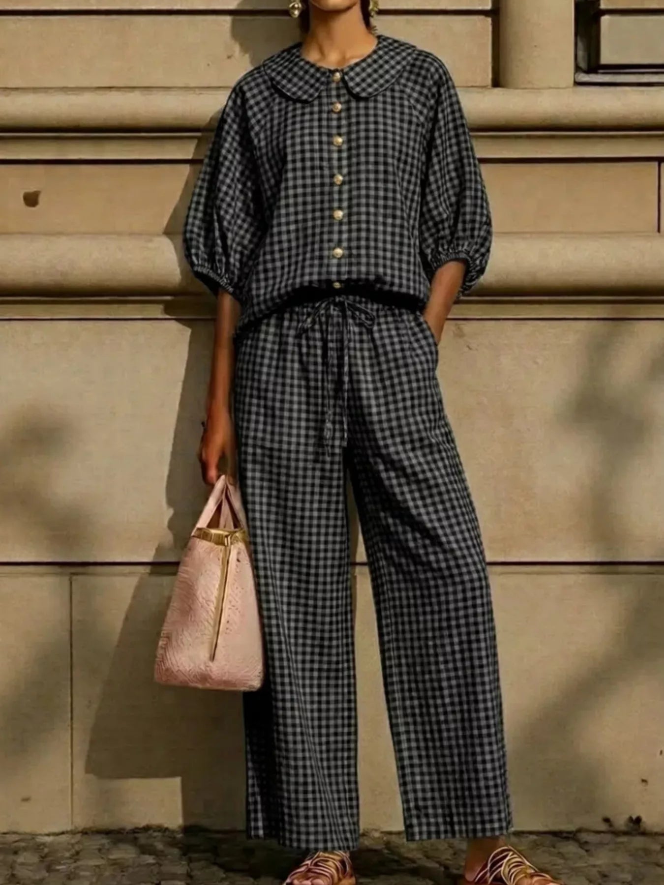 Black plaid button-up shirt and wide-leg pants set with Peter Pan collar and gold buttons.