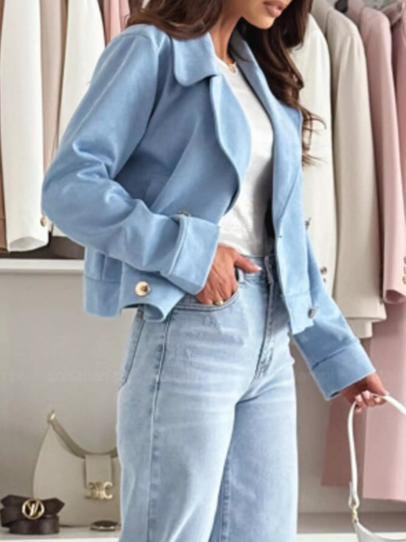 Pastel blue cropped double-breasted jacket with gold buttons and angled side pocket