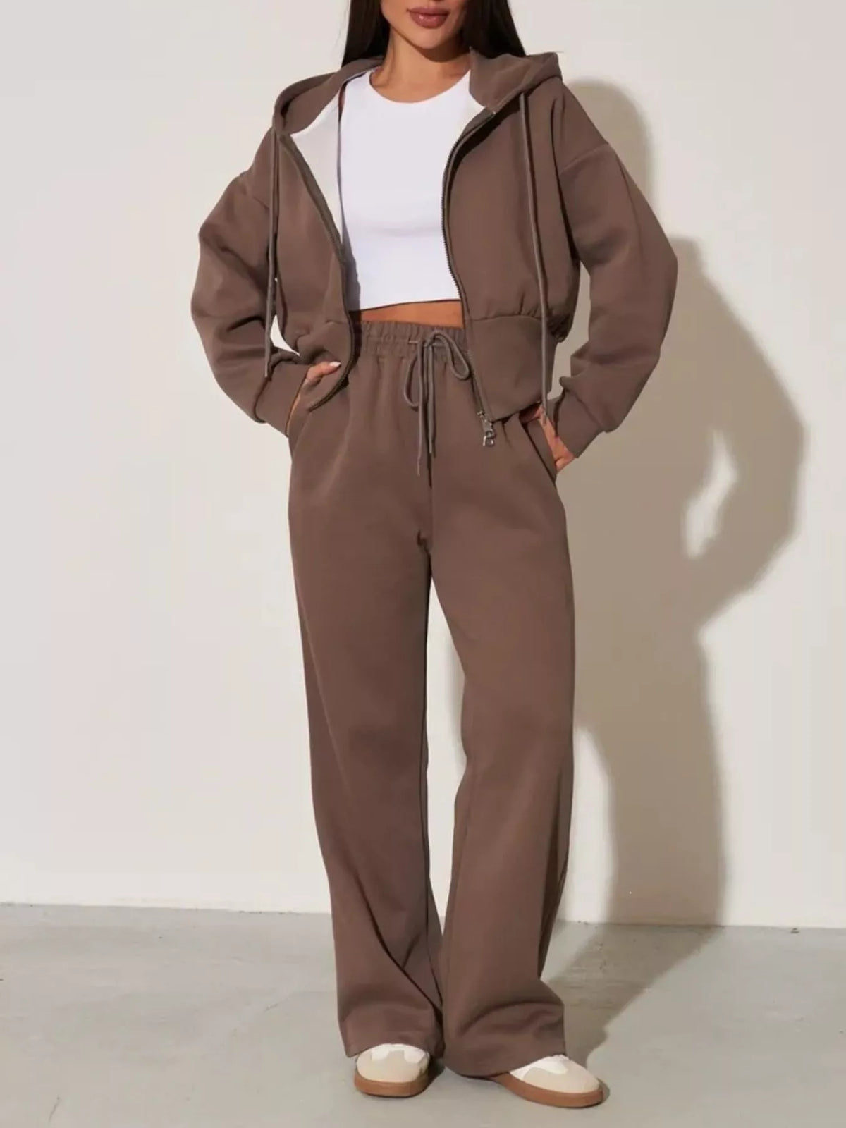 Brown zip-up hoodie and wide-leg pants set with hood and drawstring waist, full-length view