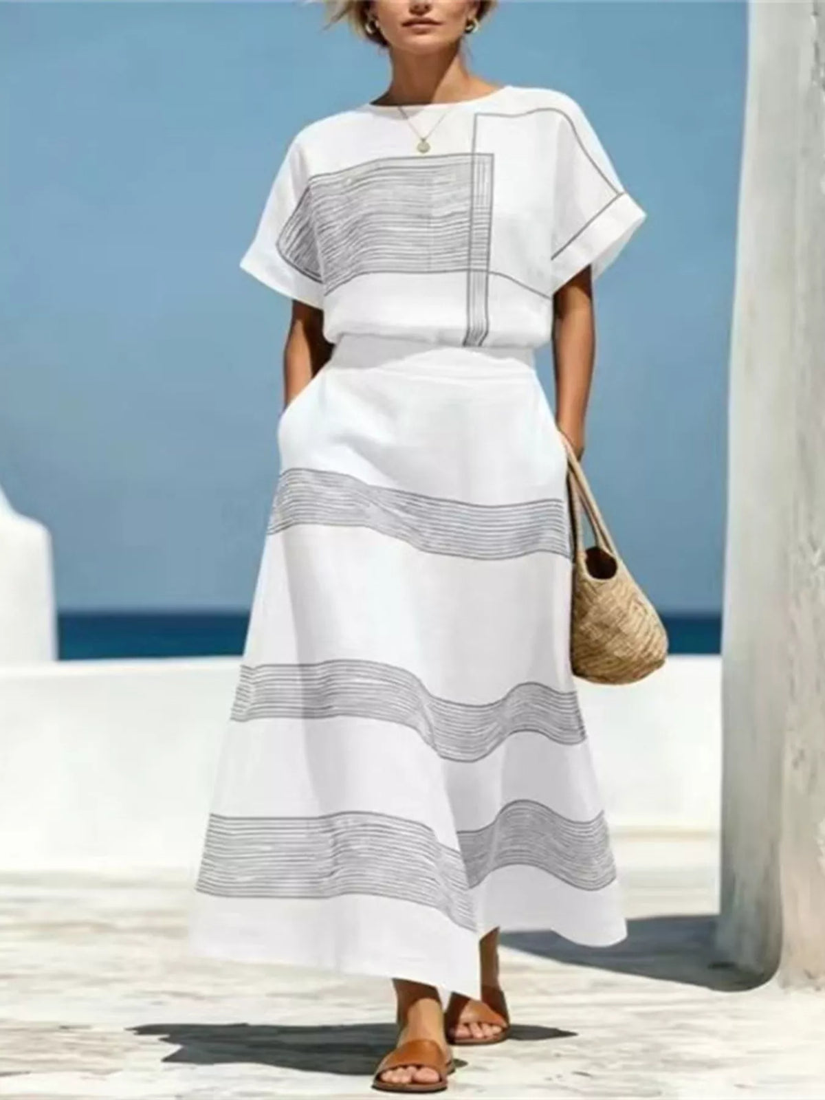 White striped round neck top and maxi skirt set with layered panel stripe graphics