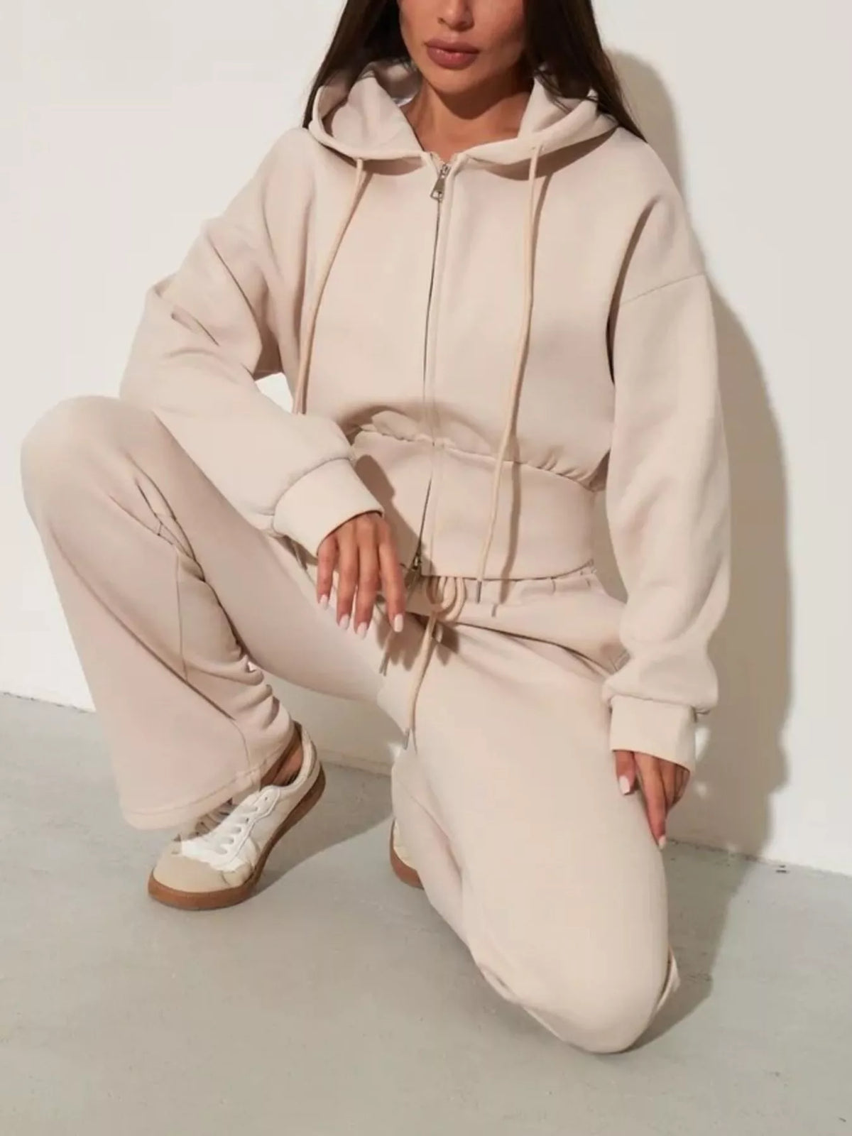 Light apricot zip-up hoodie and wide-leg pants set, hood drawstrings, cuffed sleeves
