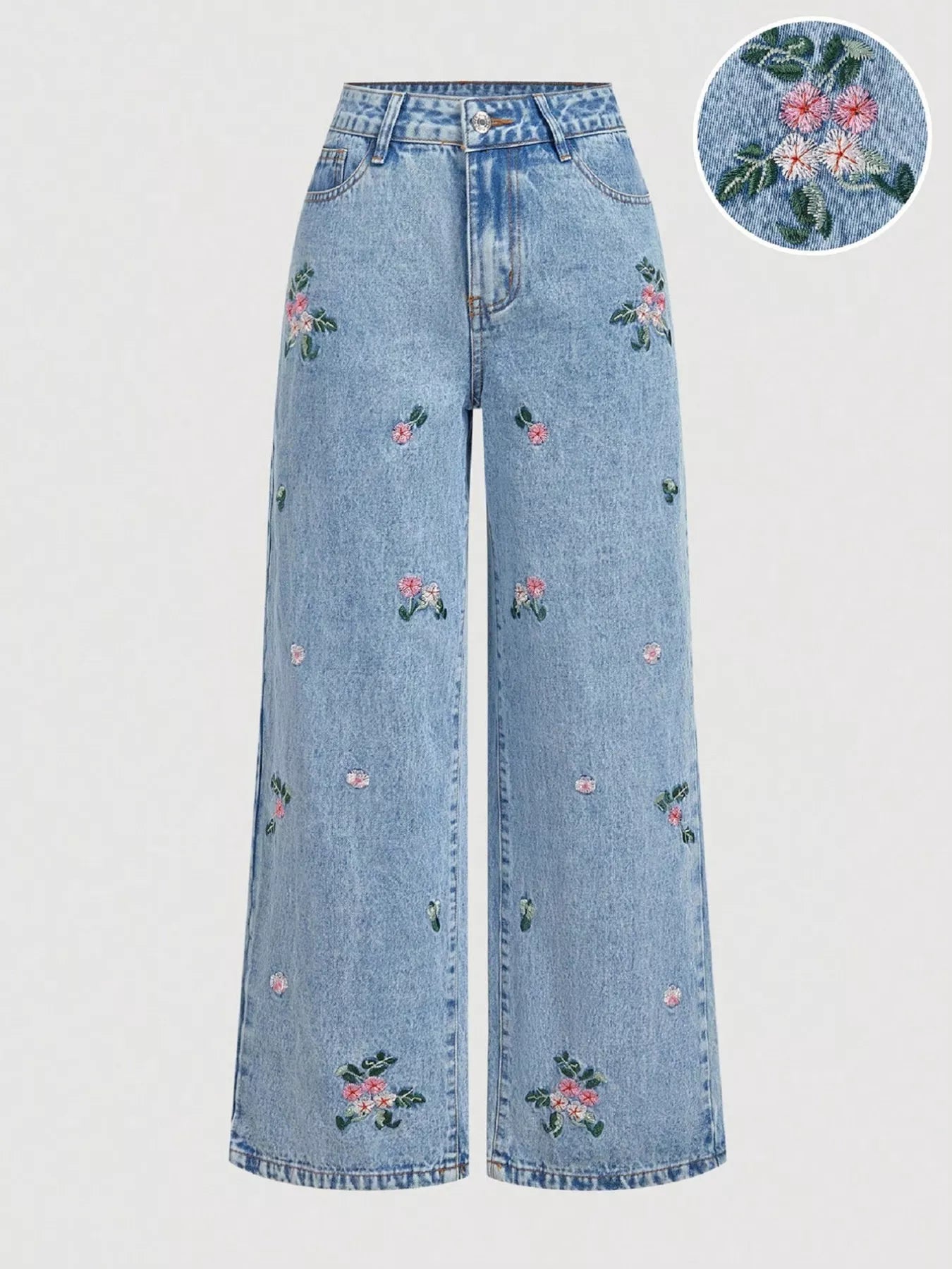 Light blue wide-leg jeans with floral embroidery on front legs and pockets