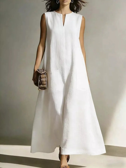 White notched sleeveless maxi dress with V notch and front pockets