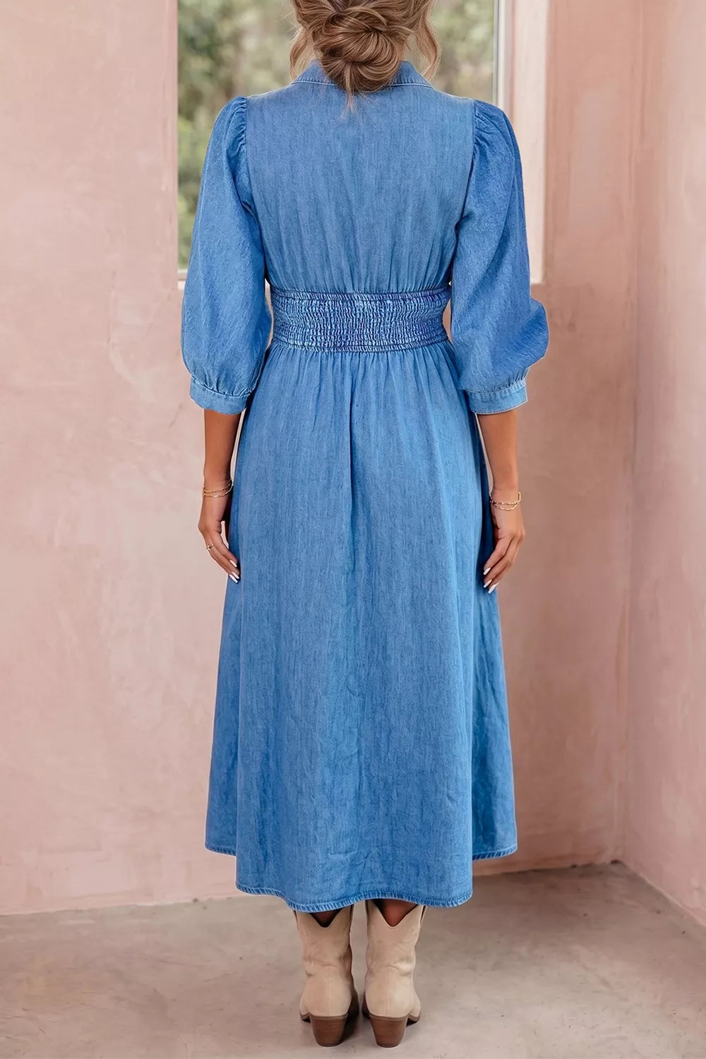 Blue denim midi dress, back view with shirred waist seam, 3/4 sleeves