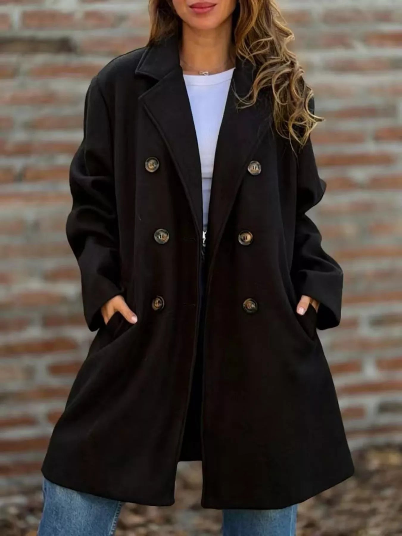 Double-breasted lapel coat in black with gold button front and notched lapels
