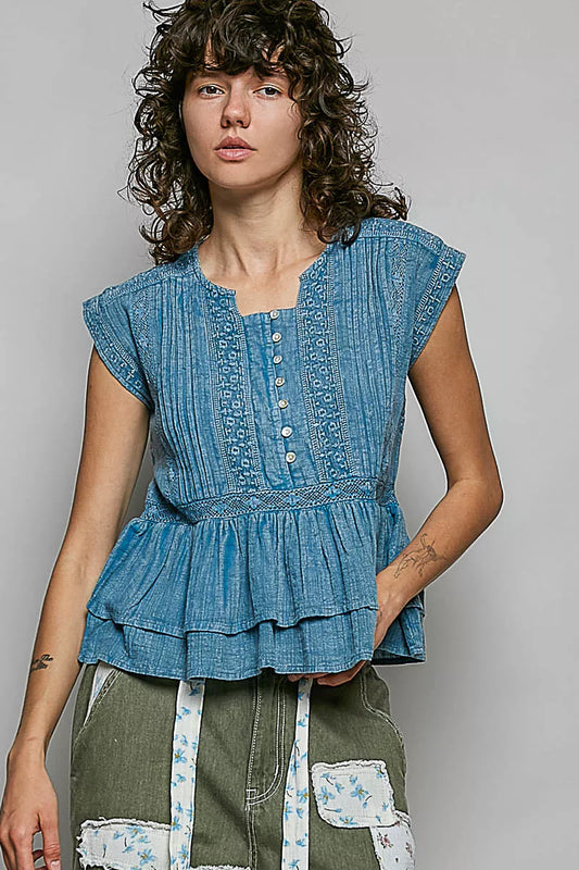 Denim blue sleeveless cotton blouse with pintuck texture, eyelet embroidery, button front