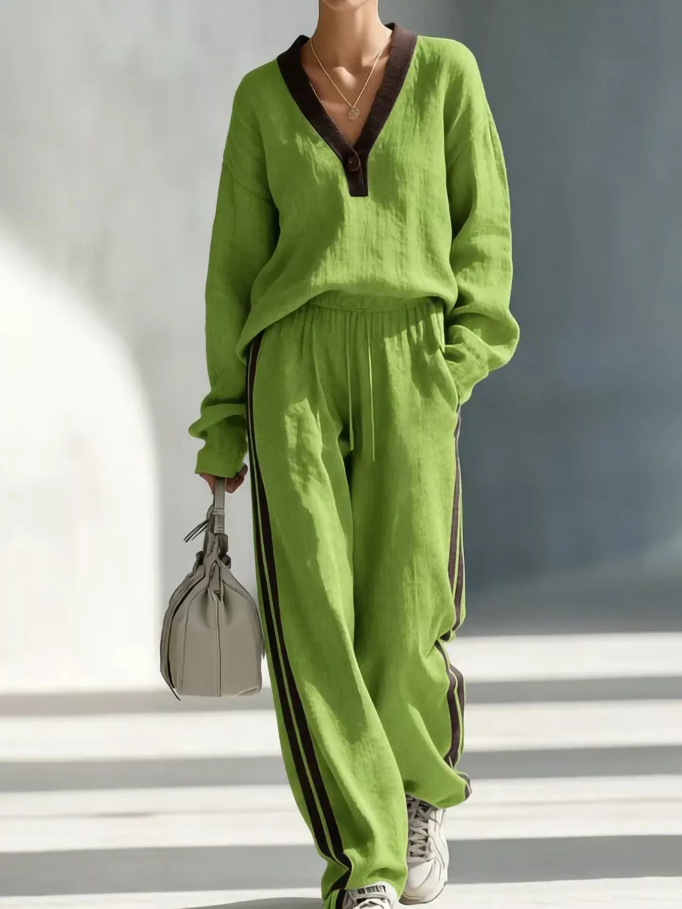 Green V-neck top and striped jogger pants set with contrast neckline