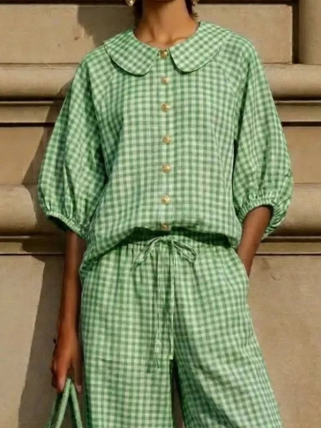 Green gingham plaid blouse and pants set, puff sleeves, gold buttons, tied waist.