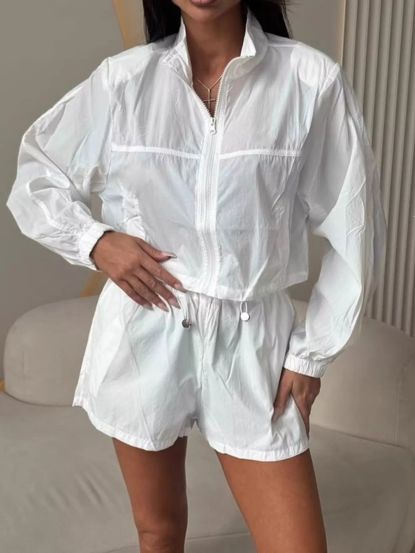 White zip-up long sleeve jacket and matching elastic-waist shorts set